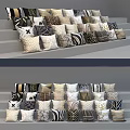 Diverse Patterned Pillows In Black White Beige And Brown Tones Arranged On Stairs