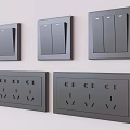 Black Modern Switch Panels with Multiple Switches and Sockets Mounted on White Wall