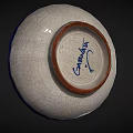 Round Ceramic Plate With Crackle Glaze And Blue Yellow Geometric Design