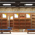 Specialty Store Interior Featuring Wooden Shelves Display Areas And Decorative Wall Patterns