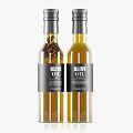 Two Transparent Glass Olive Oil Bottles With Black Label And Silver Cap Design