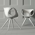 Modern White Accent Chair With Wooden Arms And Legs On Gray Wall Wooden Floor