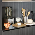 Modern Kitchen Utensils With Blender Spoons Bowls Wooden Mortar And Woven Mat On Dark Countertop