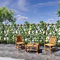 Lush Gourd Vine Covered Trellis Fence In Courtyard With Wooden Chairs And Table