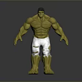 Hulk Toy With Green Skin Muscular Build Black Torn Shorts Standing Pose On Gray Background