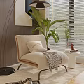 Modern Comfortable Beige Accent Chair With Plaid Blanket Throw Pillow And Green Plant Near Window