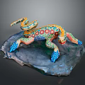 Colorful Painted Lizard Sculpture With Vibrant Patterns On Rock Base