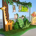 Summer Camp Themed Area Featuring Giraffe Monkey Mushroom House Green Plants And Kids