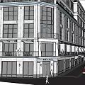 Commercial Street Featuring Multi Story Building Ground Floor Shops Balconies And Street Cars