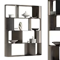 Modern Metal Shelving Unit With Open Compartments And Decorative Bowls Plates Vases