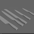 Stainless Steel Kitchen Knife Set With Various Blade Types Arranged In Row