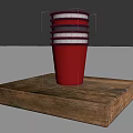 Red Cup With Black Gray Stripes Stacked On Wooden Tray