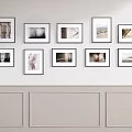 Stylish Photo Wall Display With Multiple Framed Pictures On Beige Wall
