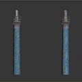 Two Blue Decorative Columns With Intricate Patterns And Ornamental Tops
