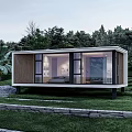 Modern Guesthouse Building With Large Glass Windows And Natural Green Surroundings
