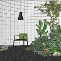 Lush Indoor Plant Combination With White Tiled Wall Black Pendant Light Green Chair And Pebbles