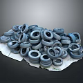 Pile of Stacked Used Tires on White Surface with Gray Background