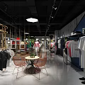 Modern Clothing Store Interior With Trendy Apparel Displays And Comfortable Seating Area