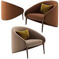 Beige Upholstered Single Sofa With Black And White Houndstooth Pillow And Dark Wooden Legs