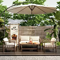 Outdoor Sofa Set With Bamboo Fence Patio Umbrella Green Plants And Armchairs