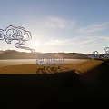 Cloud Shaped Garden Ornaments Under Blue Sky With Sunset And Mountains