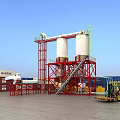 Industrial Equipment With Two White Silos Red Framework Staircase Conveyor And Blue Sky Background