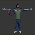 Man In Green Vest Red Text Blue Pants White Sneakers Arms Outstretched Holding Cricket Bat