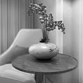 Elegant White Vase With Purple Flowers On Round Wooden Table Near Beige Chair And Curtain