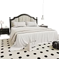 Double Bed With White Sheets Black Headboard And Bedside Tables On Polka Dot Rug