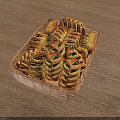 Fresh Homemade Twisted Bread Loaves in Wicker Basket on Wooden Table