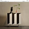 Modern Entryway Cabinet Sideboard with Black White Striped Design Metal Legs Decorative Figurine and Green Plant