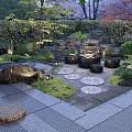 Serene Garden Landscape With Pond Stones Green Plants Trees And Stone Pathway