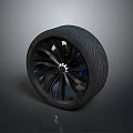 Car Tire Featuring Black Spoke Alloy Wheel And Radial Tread Design