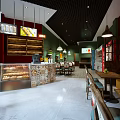 Cozy Restaurant Interior Design With Pastry Display Seating Area Colorful Tiles And Pendant Lights