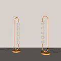 Modern Golden Floor Lamp With Transparent Glass Shades And Circular Base Design