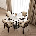Round Dining Table With Four Woven Chairs And Beige Cushions In Cozy Interior