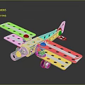 Metallic Toy Airplane Model With Holes And Assembled Metal Pieces On Dark Background