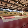 Indoor Sports Fitness Gymnasium Featuring Basketball Court Wooden Floor High Ceiling And Windows