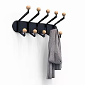 Black Wall Mounted Coat Rack With Wooden Knobs And Gray Towel On White Wall 3d model