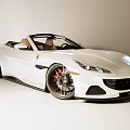 White Ferrari Convertible Car With Red Brake Calipers And Sleek Exterior Design