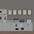 White Bookcase With Glass Doors Alongside File Cabinets Printers Folders on Top Framed Certificates on Wall