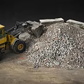 Yellow Loader At Construction Site With Rubble Pile And Large Stones