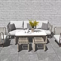 Outdoor Sofa with White and Grey Cushions by White Brick Wall and Grey Slate Floor