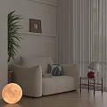Casual Sofa Set With Beige Upholstery Leaf Patterned Cushion Small Side Table And Green Plant