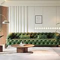 Elegant Living Room Interior With Green Velvet Sofa Wooden Coffee Table Floor Lamp And Plants