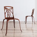 Brown Leisure Chairs with Crossed Pattern Design in Bright Room with Wooden Floor