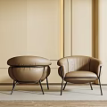 Brown Leather Armchairs Modern Design With Black Metal Legs Against Light Colored Wall