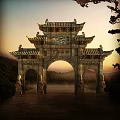 Traditional Chinese Stone Archway With Intricate Carvings And Mountain Landscape