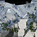 Banquet Hall With Blue And White Floral Decorations Circular Chandelier And Elegant Stage Backdrop