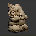 Light Brown Ganesha Sculpture With Detailed Trunk Ears Seated Posture On Dark Background With Reflection